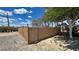 Fenced backyard with shade trees, gravel, and privacy at 2650 Sagebrush Ave, Pahrump, NV 89048