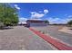 View of backyard with gravel, building, and a brick path at 2650 Sagebrush Ave, Pahrump, NV 89048