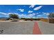 Large backyard with gravel and a red brick path at 2650 Sagebrush Ave, Pahrump, NV 89048