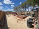 Backyard featuring garden beds and graveled ground at 2650 Sagebrush Ave, Pahrump, NV 89048