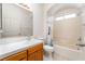 Well-maintained bathroom features a tiled shower-tub combination, a window for natural light, and vanity at 2650 Sagebrush Ave, Pahrump, NV 89048