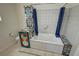 Bathroom featuring a unique tub with colorful tiled accents and a privacy curtain at 2650 Sagebrush Ave, Pahrump, NV 89048