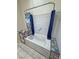 Bathroom featuring a unique tub with colorful tiled accents and a privacy curtain at 2650 Sagebrush Ave, Pahrump, NV 89048