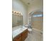 Full bathroom with tub and shower, tile floors and single sink at 2650 Sagebrush Ave, Pahrump, NV 89048