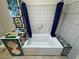 Bathroom featuring a unique tub with colorful tiled accents and a privacy curtain at 2650 Sagebrush Ave, Pahrump, NV 89048