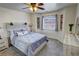 Comfortable bedroom with updated decor, a ceiling fan, and a view of the mountains at 2650 Sagebrush Ave, Pahrump, NV 89048
