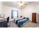 Cozy bedroom provides natural light, with a desk for studying and dark wood dresser at 2650 Sagebrush Ave, Pahrump, NV 89048