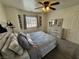 Serene bedroom with natural light, soothing decor, and modern ceiling fan at 2650 Sagebrush Ave, Pahrump, NV 89048