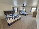 Spacious bedroom with comfortable beds, soft carpet, and inviting natural light from the windows at 2650 Sagebrush Ave, Pahrump, NV 89048