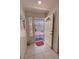 Tiled entryway featuring an open white door and a view of the home's exterior at 2650 Sagebrush Ave, Pahrump, NV 89048