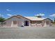 Charming single-story home with desert landscaping, light stucco, and a blue door at 2650 Sagebrush Ave, Pahrump, NV 89048