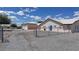 Charming home with a gated gravel driveway, ample parking and well-maintained landscaping at 2650 Sagebrush Ave, Pahrump, NV 89048