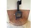 Close up of a cozy corner electric fireplace with decorative tiled surround at 2650 Sagebrush Ave, Pahrump, NV 89048