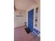 View of the front door and the concrete benches on the porch of this home at 2650 Sagebrush Ave, Pahrump, NV 89048