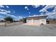 Detached two car garage with chain link fence at 2650 Sagebrush Ave, Pahrump, NV 89048