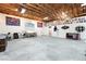 Bright garage interior with creative wall art, comfortable seating, and diverse work areas for flexibility at 2650 Sagebrush Ave, Pahrump, NV 89048