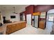 Large kitchen with stainless steel refrigerator and convenient island with tile countertops at 2650 Sagebrush Ave, Pahrump, NV 89048