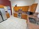 Functional kitchen showcasing updated appliances, abundant cabinet space, and a tiled floor at 2650 Sagebrush Ave, Pahrump, NV 89048