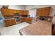 Spacious kitchen includes ample counter space, tiled backsplash, and warm oak cabinetry at 2650 Sagebrush Ave, Pahrump, NV 89048