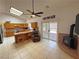 Open floor plan shows kitchen with breakfast bar and access to patio at 2650 Sagebrush Ave, Pahrump, NV 89048