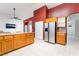 Spacious kitchen featuring wood cabinets, tile countertops, stainless steel appliances, and an eating area that enhances functionality at 2650 Sagebrush Ave, Pahrump, NV 89048