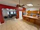 Open kitchen boasts a central island, tiled floors, and seamless flow to the living area at 2650 Sagebrush Ave, Pahrump, NV 89048
