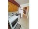 Bright laundry room with modern appliances and storage cabinets at 2650 Sagebrush Ave, Pahrump, NV 89048
