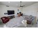 Spacious living room with plush carpeting, comfortable seating, and a ceiling fan at 2650 Sagebrush Ave, Pahrump, NV 89048