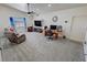 Spacious living room with plush carpeting, natural light, and comfortable seating at 2650 Sagebrush Ave, Pahrump, NV 89048