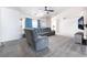 Comfortable living room with plush carpeting, stylish furniture, and bright windows, creating a welcoming space at 2650 Sagebrush Ave, Pahrump, NV 89048