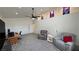 Bright living area with plush armchairs, neutral walls, and carpeted floors offer relaxation at 2650 Sagebrush Ave, Pahrump, NV 89048