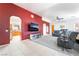 The open living room layout includes both carpeted and tiled areas, seamlessly connecting to a bright kitchen space at 2650 Sagebrush Ave, Pahrump, NV 89048