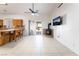 Open living area boasts tile floors, a cozy wood burning stove, and convenient access to kitchen and outdoor spaces at 2650 Sagebrush Ave, Pahrump, NV 89048