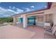 Spacious covered outdoor area, perfect for entertaining, featuring patio swing, benches, and seating at 2650 Sagebrush Ave, Pahrump, NV 89048