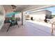 Covered patio area features an outdoor swing, providing a relaxing space for outdoor seating and enjoyment at 2650 Sagebrush Ave, Pahrump, NV 89048
