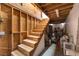 Unfinished wooden staircase providing access to the lower level of the home at 2650 Sagebrush Ave, Pahrump, NV 89048