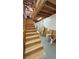 Plywood stairway leading to additional storage space with open beams and a concrete foundation at 2650 Sagebrush Ave, Pahrump, NV 89048