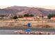 Street view capturing the home and mountain backdrop, enhanced with a blue mailbox at 2650 Sagebrush Ave, Pahrump, NV 89048