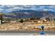 Street view capturing the home and mountain backdrop, enhanced with a blue mailbox at 2650 Sagebrush Ave, Pahrump, NV 89048