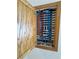 Exposed utility connections behind a cabinet door reveal plumbing and electrical components at 2650 Sagebrush Ave, Pahrump, NV 89048