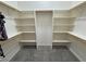 Walk-in closet with carpet and custom shelving at 2650 Sagebrush Ave, Pahrump, NV 89048
