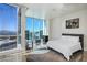 Bright bedroom featuring floor-to-ceiling windows with city views, hardwood floors, and modern decor at 2700 Las Vegas Blvd # 4305, Las Vegas, NV 89109