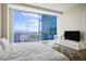 Bright bedroom with city views, a sleek TV stand, and a comfortable bed at 2700 Las Vegas Blvd # 4305, Las Vegas, NV 89109