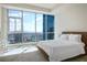 Bright bedroom featuring floor to ceiling windows with a panoramic city view and a king size bed at 2700 Las Vegas Blvd # 4305, Las Vegas, NV 89109