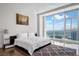 Bright bedroom with a large window offering stunning city views and a comfortable bed at 2700 Las Vegas Blvd # 4305, Las Vegas, NV 89109