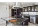 Gourmet kitchen boasts granite counters, an island cooktop, stainless appliances, and sleek, modern cabinetry at 2700 Las Vegas Blvd # 4305, Las Vegas, NV 89109