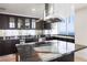 Modern kitchen featuring granite countertops, stainless steel appliances, and a center island with cooktop at 2700 Las Vegas Blvd # 4305, Las Vegas, NV 89109