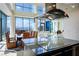 Open kitchen area with bar and access to dining and living areas featuring panoramic city views at 2700 Las Vegas Blvd # 4305, Las Vegas, NV 89109