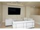 Contemporary living room with modern white furniture, sleek lines and a large screen television at 2700 Las Vegas Blvd # 4305, Las Vegas, NV 89109