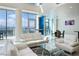 Bright living room with floor-to-ceiling windows and modern white sofas overlooking the cityscape at 2700 Las Vegas Blvd # 4305, Las Vegas, NV 89109